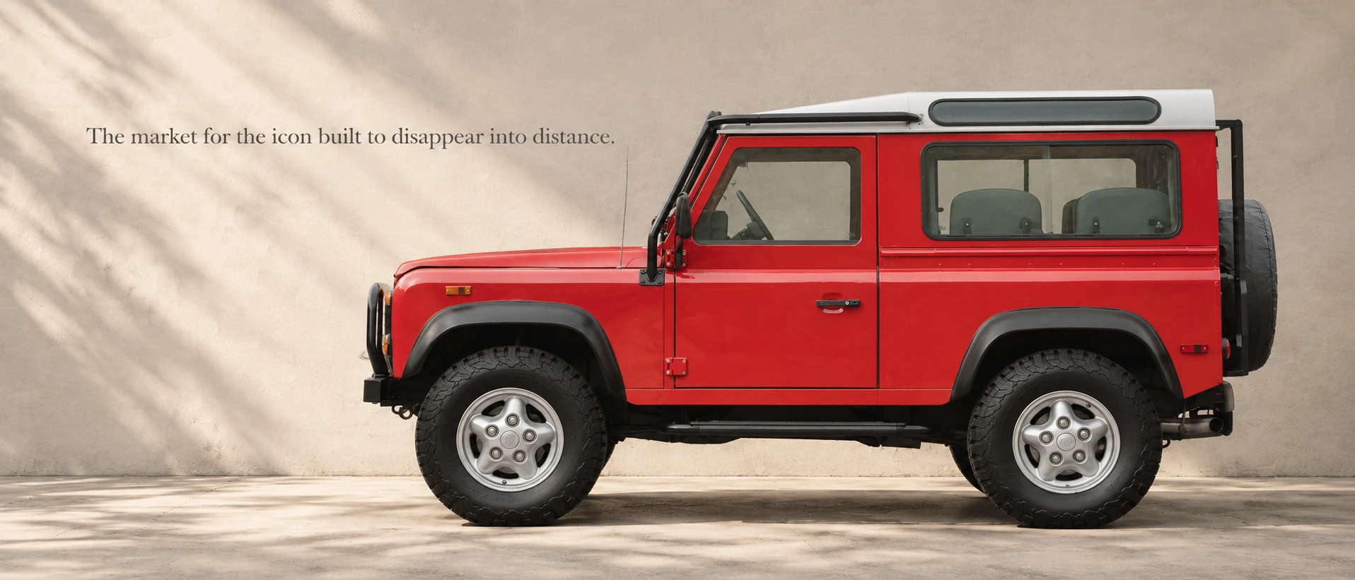 Portofino Red Defender 90 NAS Station Wagon in side profile